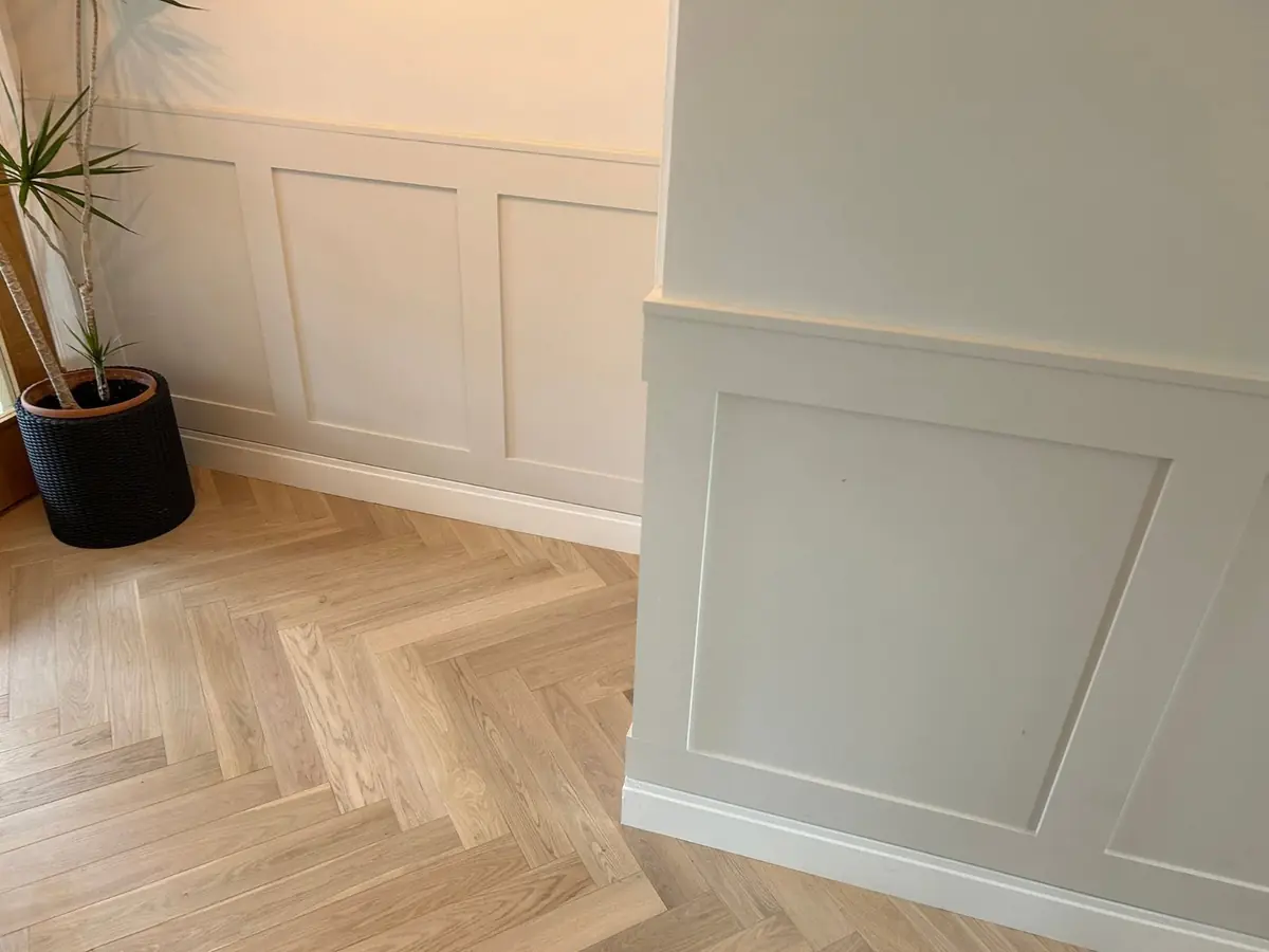 Shaker wall panelling and herringbone oak flooring fitted by Precision Joinery & Tiling