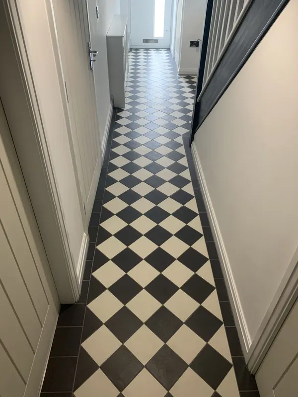 Large format porcelain floor tiles laid in a herringbone pattern in a Blackpool home